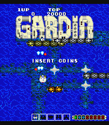 The title screen displays 'GARDIA' in large yellow pixelated letters centered at the top against a bright blue starfield background. Below the title, 'INSERT COINS' appears in white text. The screen shows a sprite-based space scene with a player ship in the center firing white projectiles, surrounded by small enemy formations in yellow and orange. A status bar at the bottom displays a health meter on the left and a yellow coin counter on the right, typical of arcade game UI from the 1980s.