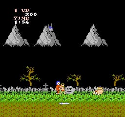 A pixelated side-scrolling level displays a knight character in the center of a grass-filled stage with brown dirt beneath. Three snow-capped mountain peaks sit at the top of the screen against a black sky. Two golden torch-like objects flank the character on the grass. The score counter in the upper left shows "UP 2000" and "2192". Yellow-green grass and tan soil form the ground layer with clear sprite-based pixel art typical of mid-1980s NES graphics.