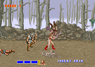 A large brown creature with spikes stands on rocky terrain in a forest of bare trees. Two player characters in orange and red clothing face the monster from the left side of the screen. The bottom UI shows a blue health bar on the left and an "INSERT COIN" prompt on the right. Small enemy sprites are visible on the far left. The background features parallax-scrolled purple-gray sky and tall tree trunks receding into distance. Pixel art sprites with limited color palette typical of late-1980s arcade hardware.