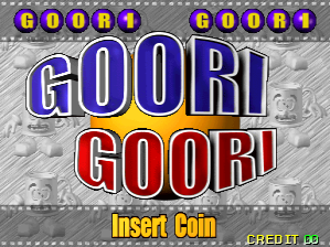 The title screen displays 'GOORI GOORI' in large blue and red outlined text stacked vertically in the center. Above the title, two small circular badges reading 'GOORI' appear in the upper corners with purple and yellow coloring. The background shows a gray pixelated pattern with repeated small character sprites. At the bottom, yellow text reads 'Insert Coin' with 'CREDIT 0' displayed in the lower right corner. The overall design uses a simple arcade aesthetic with limited color palette and pixel-art styling typical of late-1990s arcade cabinets.
