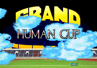 The title screen displays "GRAND HUMAN CUP" in large yellow and cyan text against a black background, with stylized white clouds scattered across the upper portion. Below the title text sits a soccer stadium rendered in low-resolution sprites, showing a green field, brown grandstand structure, and blue sky. The word "CHE" appears in small text at the bottom right corner. The overall aesthetic uses limited colors typical of early 1990s arcade hardware, with flat sprite-based graphics and minimal animation visible.