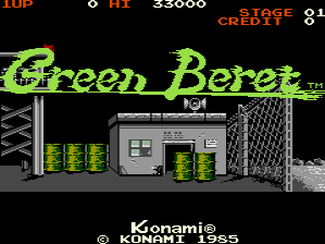 The title screen displays 'Green Beret' in large yellow-green pixelated letters across the center. Above it, a score display shows 'TOP 33000', 'HI 33000', and 'STAGE' with '2*1' indicator in red text. Below the title, a gray industrial structure with metal framework and vents is rendered in monochrome, flanked by yellow-green vertical bar graphics on both sides. The Konami copyright and 1985 date appear in white text at the bottom. The background is solid black, typical of early 1980s arcade game aesthetics.