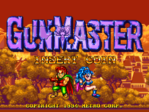 The Gun Master arcade title screen features large blue and orange pixel-art lettering for the game title at the top. Below the title, yellow text reads "INSERT COIN". Two sprite-based characters appear in the lower half: a green-suited figure on the left and a blue robot-like character on the right, both standing against a brown and gold textured background with brick or stone patterns. Copyright text for Taito and Metro appears at the bottom in small white lettering.