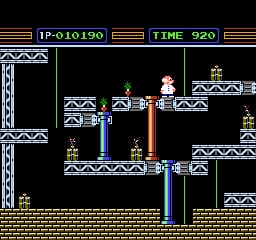 A side-scrolling level displays a small character sprite standing on a platform in the center of the screen, surrounded by multiple stationary gyro platforms arranged on different vertical levels. The HUD shows "IP-010190" in the top-left and "TIME 920" in the top-right against a black background. The level layout features tan-colored solid platforms with decorative metal trim at the edges, set against a black void. Multiple small gold-colored objects are positioned on various platforms throughout the stage, likely collectibles or objectives.
