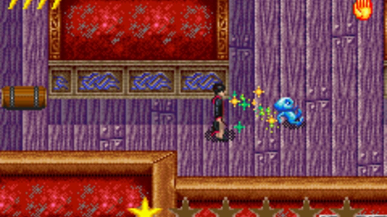 A character with dark hair stands on a purple-walled indoor platform facing a blue octopus-like creature surrounded by yellow and green projectiles. A wooden barrel sits on the left ledge, and red patterned walls with ornate gold trim frame the upper portion. The pixel art uses a vibrant color palette with purple vertical striping on the walls and brown wooden trim running horizontally across the scene. A yellow star shape appears at the bottom left corner.