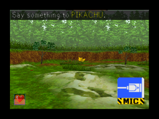 A 3D rendered outdoor scene shows a green grassy field with layered terrain in the foreground, brown soil bands in the middle distance, and lighter green background foliage. A small yellow Pikachu sprite appears near center-left. The top-left corner displays the text "Say Something to PIKACHU," while a red Pokéball icon and "MICE" branding are visible in the bottom-left and bottom-right corners respectively. The image has black borders framing the N64-era 3D graphics.