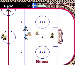 An overhead view of an ice hockey rink with two teams of pixelated players positioned across the ice. The rink features a center red line, two blue lines, and circular face-off zones marked with directional arrows. Player sprites are scattered in the middle and near the goals on both ends. The UI displays score zeros in the upper left corner and the Nintendo logo in the lower right. Magenta boards frame the rink's perimeter against a light background.