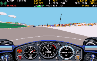 A first-person view from inside a race car cockpit shows a detailed instrument panel with multiple gauges and dials across the bottom. The track ahead curves to the right with grandstands visible along the sides filled with spectators rendered in orange tones. The sky is bright blue with white clouds, and the road surface is gray asphalt. A heads-up display at the top shows lap information, speed, and race statistics. The graphics use flat shading with a limited palette typical of late 1980s DOS racing simulation visuals.