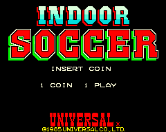 The title screen displays "INDOOR SOCCER" in large, multi-colored pixelated text with a red outline against a black background. Below the title, white text reads "INSERT COIN" followed by "1 COIN 1 PLAY" on separate lines. At the bottom of the screen, red text identifies the publisher as "UNIVERSAL" with a copyright mark. The overall design uses a simple arcade aesthetic with bright primary colors and blocky pixel-based typography typical of 1985 arcade cabinets.
