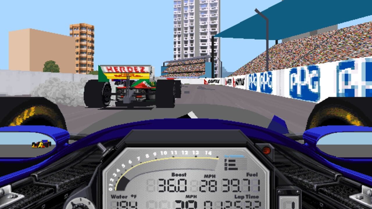 A first-person view from an IndyCar cockpit shows a blue-and-black car interior with dashboard instruments displaying boost at 316.0, MPH at 29, fuel at 39.7, water temperature, and lap time. Ahead on a street circuit, a competitor's car with Energizer branding navigates past grandstands filled with spectators and tall residential buildings. The track features teal overhead signage, white concrete barriers with blue advertisements, and a clear blue sky. The HUD shows pixel-art graphics typical of 1990s racing simulation software.