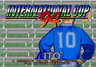A blue-shirted soccer player wearing number 10 stands prominently in the center, photographed from behind against a stadium background with green seating. The 'International Cup '94' title appears at the top in blue and red letters with yellow accents. Below the player figure, small white text displays game information and credits for Taito Corporation. The stadium backdrop features repeating rows of green seats rendered in a flat, pixelated style typical of early 1990s arcade graphics.