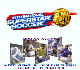 The title screen displays the International Superstar Soccer Deluxe logo at the top in red and blue text with a gold trophy graphic. Below is a "PRESS START" prompt surrounded by five rectangular photographs showing soccer players in various uniforms and action poses. A copyright notice for Konami from 1995 appears at the bottom in small white text. The background is plain light gray, and the overall layout is centered and symmetrical.