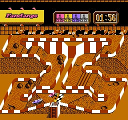 An off-road racing course viewed from above displays a brown dirt track with white lane markers forming a winding path. A small vehicle sprite appears near the bottom center of the screen. The HUD shows a timer reading 04:56 in the upper right, a score display panel in the upper center, and the game title in the upper left. The track layout features multiple turns and straightaways across the full screen width, rendered in tan and brown pixel art against a yellow border frame.