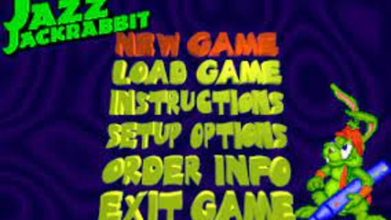 A menu screen with bright yellow-green text on a dark blue background displays options vertically: NEW GAME, LOAD GAME, INSTRUCTIONS, SETUP OPTIONS, ORDER INFO, and EXIT GAME. The Jazz Jackrabbit logo in lime green appears in the upper left corner, while a pixel-art sprite of a green rabbit character with red accents holding a weapon is positioned on the right side of the screen.