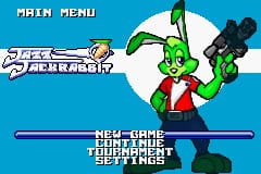 A bright turquoise background displays the Jazz Jackrabbit title screen with a large green cartoon rabbit character center-stage, wearing red clothing and raising both arms triumphantly. At the top left, white text reads "MAIN MENU" in a pixelated font. Below the rabbit, a blue horizontal bar separates three menu options in white text: "NEW GAME", "CONTINUE", and "HIGH SCORES". The sprite artwork uses a limited color palette typical of Game Boy Advance hardware, with the character rendered in bright greens and reds against the blue background.