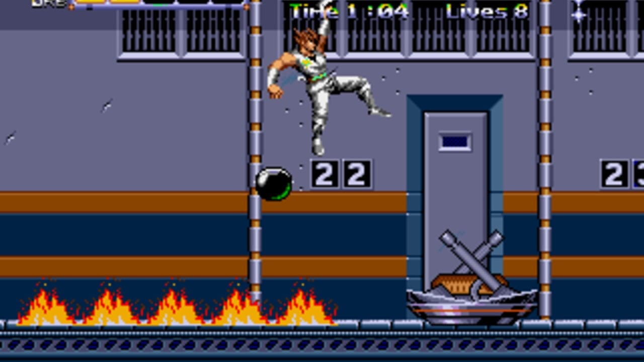 A brown-haired swordsman in white and gray armor jumps mid-air in an industrial corridor with purple metal walls and orange-banded support columns. Flames flicker along the bottom edge of the screen. A green circular bomb or mine sits on the ground below. A tall gray door with crossed axes hangs on the right wall. The HUD displays "Time 1:04", "Lives 8", and "22" in the center-bottom. Barred windows line the upper background. The sprite-based graphics use a limited 16-bit color palette with clean pixelated character animation.