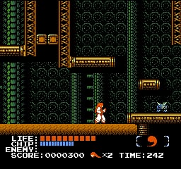 A pixelated character with orange/red coloring stands in the center of an ornate corridor with dark patterned walls and gold-trimmed architectural elements. The scene displays a side-scrolling level layout with doorways and platforms visible to the left and right. The HUD at the bottom shows a blue health bar, score display reading 00000300, lives remaining indicated by symbols, and a timer showing 2:42. The sprite-based graphics use a limited NES color palette of greens, golds, blacks, and flesh tones against the dark environment.