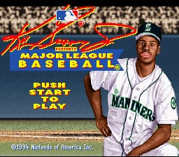 The title screen displays the game logo in large red and yellow lettering at the top, with a crowded stadium background. Below the text, a baseball player wearing a white uniform with blue trim and a blue cap stands in a batting pose facing right. Yellow text reading "PUSH START TO PLAY" appears in the lower portion. The image uses 16-bit sprite graphics with a bright color palette typical of early 1990s SNES sports games.