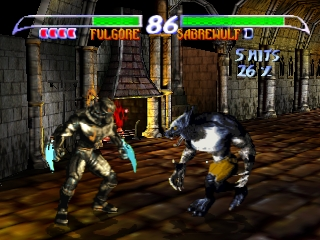 Two fighters face off in a stone arena with brown tiled flooring and ornate architectural details. The left character wears metallic armor and holds a fighting stance, while the right character is darker and more compact. Health bars display at the top in green, with round number 86 and time remaining visible. The UI shows "FULL GAME" text on the left and "JAGUARMLT" on the right side of the screen. The 3D characters are rendered with flat shading typical of mid-1990s polygon graphics, set against a textured background featuring arched doorways and columns.
