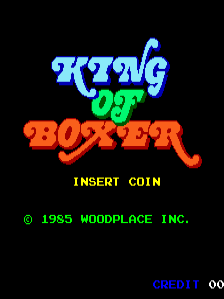 The title screen displays "KING OF BOXER" in large blue and red pixelated letters centered on a black background. Below the title, yellow text reads "INSERT COIN". At the bottom, green copyright text states "© 1985 WOODPLACE INC." with "CREDIT" in blue in the lower right corner. The lettering uses a bold, chunky arcade font style typical of 1980s arcade games.