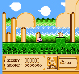 A side-scrolling level displays Kirby as a small pink sprite in the center-left foreground, with a blue sky containing white clouds and a large yellow sun above a landscape of green grass, brown pipe structures, and blue water. The bottom UI panel shows Kirby's status with text reading "KIRBY: 000000" and "SCORE: 0000000" on the left, a small Kirby icon in the center, and "30<04" on the right. The sprite art uses a limited NES-era color palette with distinct pixelation typical of early-1990s Nintendo hardware.