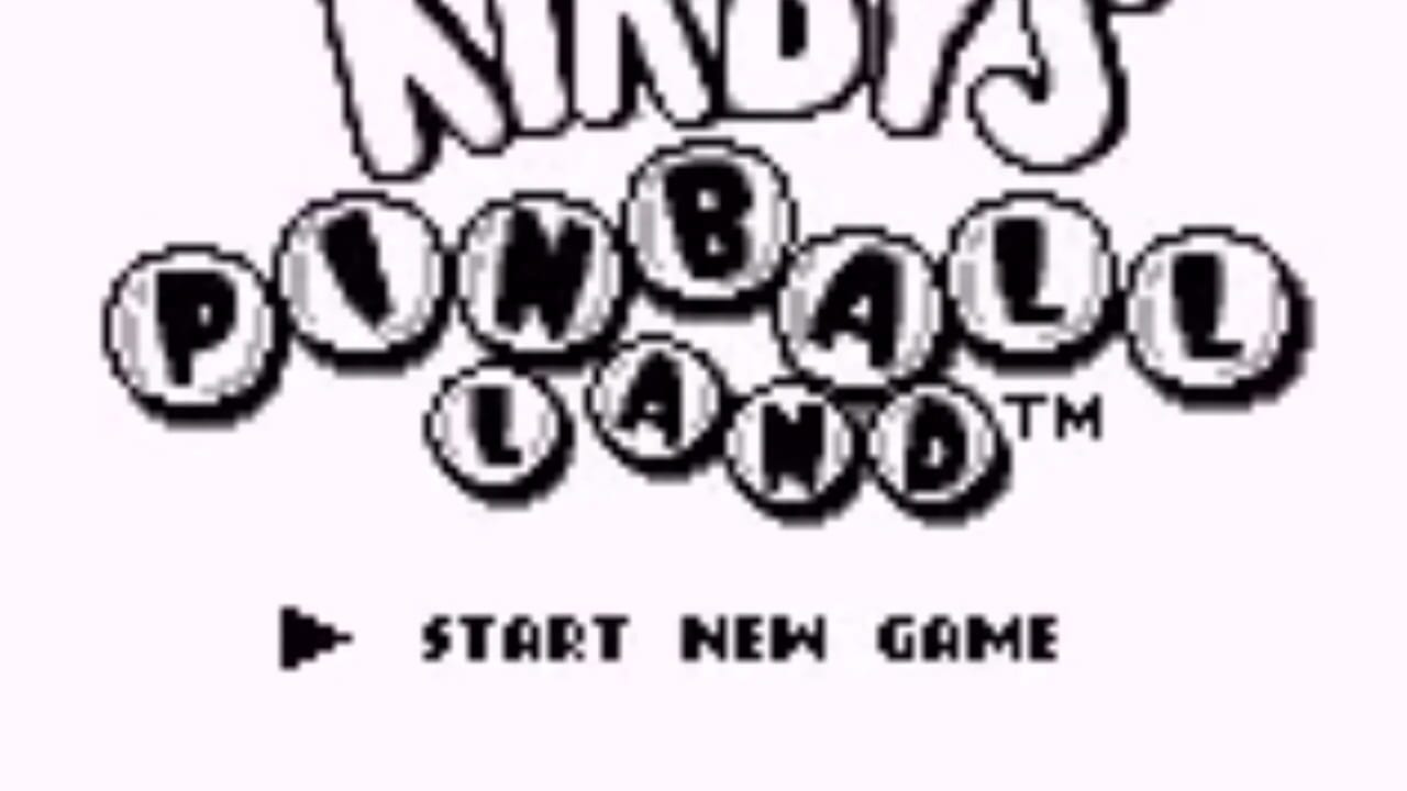 The title screen displays 'Kirby's Pinball Land' in large pixelated letters arranged in circular button shapes across the upper portion, with a trademark symbol visible. Below the logo sits a play icon followed by the text 'START NEW GAME' in blocky 8-bit font. The background is plain white, and the entire image uses black and white monochrome graphics typical of Game Boy hardware.