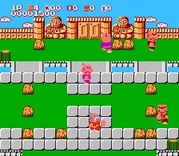 The screen displays a side-scrolling level with a blue sky backdrop and brown castle-like structures at the top. Two player characters stand on a series of white stone platforms arranged across the green grass ground. Red and orange enemy sprites are positioned on various platform levels throughout the screen. A score and health display panel runs across the top edge showing numerical values. The art style uses bright primary colors with 8-bit pixelated sprites typical of NES-era graphics.