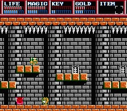 A pixel-art dungeon interior displays three vertically stacked stone brick chambers with orange-brown colored platform blocks. A small character sprite stands in the left chamber near the floor level. The top UI bar shows status information including LIFE, POWER METER, KEY, GOLD, and ITEM indicators. Gray stone walls dominate the background with varying brick patterns. Orange platforms and blocks are scattered throughout each chamber, creating a maze-like level structure typical of early NES action-adventure gameplay.