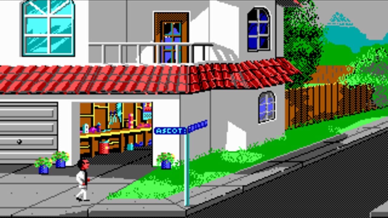 A pixel-art street scene showing a white-clad character standing on a gray sidewalk in front of a residential building. The building features a red tile roof, cyan-framed window, brown doorway with a yellow storefront display showing colorful interior details, and a blue-framed window. A blue street sign reading "ESCOT" stands at road level. To the right, green grass, brown wooden fence, and shrubs frame the scene. Mountains appear in the cyan sky background. A garage door with horizontal slats is visible on the left side of the building.