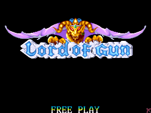 The title screen displays the "Lord of Gun" logo in large blue and white lettering centered horizontally, topped by a golden ornamental crown with purple curved horns extending outward on both sides. Below the logo, the text "FREE PLAY" appears in gray capital letters against a solid black background. The overall composition uses bright primary colors against the dark background, with a sprite-based arcade aesthetic typical of early 1990s IGS arcade games.