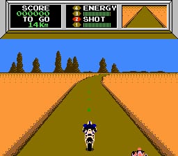 A motorcycle rider in white and blue sits on a bike centered on a brown road stretching into the distance. The road is bordered by orange terrain on both sides, with a row of dark green trees along the horizon against a blue sky. A status bar at the top displays "SCORE", "ENERGY", and "SHOT" meters in black text with yellow gauge indicators, and an orange-brown rectangular panel on the right. The scene uses simple pixel art with a flat, scrolling perspective view typical of early NES racing games.