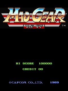 The Mad Gear title screen displays the game logo in large, stylized blue and red lettering at the top center of a black background. Below the logo, green text shows "HI SCORE 100000" and "CREDIT 00" aligned to the left. At the bottom, white copyright text reads "©CAPCOM CO.,LTD. 1989". The screen uses a simple two-color arcade aesthetic with pixel-based typography typical of late-1980s arcade games.