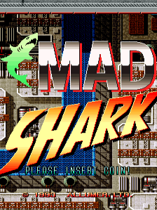 A large green shark sprite occupies the left side of the screen, facing right with mouth open. The title "MAD SHARK" appears in white and red capital letters across the center, with blue and orange accents beneath. The subtitle "PURPOSE INSECT CONTROL" is displayed in yellow text at the bottom. The background shows a pixelated industrial or urban setting with brown and red tones, featuring window and wall details typical of early 1990s arcade graphics.