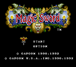 The Magic Sword title screen displays ornate gold and jeweled decorative borders framing the logo at the top center. Below the title, a small sprite of a wizard or warrior holding a staff appears centered. Menu options "START" and "OPTION" are positioned in white text in the middle section. Copyright text for Capcom appears at the bottom, with dates 1990-1992. The background is solid black, creating high contrast with the colorful title artwork rendered in 16-bit pixel art style typical of early 1990s arcade-to-console ports.