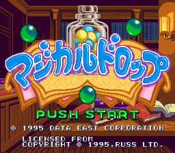 The title screen displays the blue "Magical Drop" logo centered prominently against a warm-toned interior background with burgundy walls, yellow trim, and orange doorways. Green ornamental spheres hang above the logo. Below the title, "PUSH START" appears in cyan text. Copyright information for Data East and licensing details from 1995 are visible at the bottom in white and blue text. The overall art style uses 16-bit sprite graphics with a warm color palette dominated by yellows, oranges, and purples.