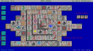 A Mah Jongg solitaire board occupies the center of a blue screen, displaying a pyramid-shaped arrangement of tan tiles marked with Chinese characters, symbols, and decorative patterns. The playfield contains approximately 100+ tiles stacked in multiple layers. A vertical score or information panel appears on the right side with Chinese text. At the bottom of the screen, a horizontal row of remaining tiles is visible. The interface uses a simple DOS-era color palette with blue background, tan tile faces, and red/black character markings. UI elements and status text appear in the top corners.