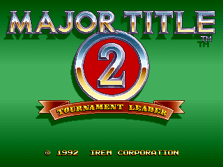 A green background displays the Major Title 2 logo centered on screen, featuring a large red circular emblem with a blue number 2 inside, flanked by silver metallic ring borders. Below the emblem sits a red banner reading 'TOURNAMENT LEADER' in yellow capital letters. Copyright text reading '© 1992 IREM CORPORATION' appears in white at the bottom of the screen. The overall composition uses a simple, bold layout typical of early 1990s arcade title screens.