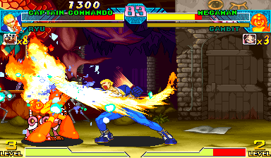 A blue-suited character performs a spinning kick attack against an orange flame-wielding opponent on the left side of the screen. Explosions and fire effects dominate the center, with a stone brick building visible in the background. The top UI displays a score of 7300, character portraits on both sides, and health bars. The art style uses colorful 2D sprites with bright reds, blues, and yellows against a darker background. A combo counter and damage numbers appear mid-screen during the active attack sequence.