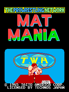 The title screen displays "THE PRO WRESTLING NETWORK" in yellow text at the top, followed by "MAT MANIA" in large red and cyan letters. Below is a blue rectangular area containing a TWA (The Wrestling Alliance) logo oval with a red wrestler figure in a fighting pose at the center. At the bottom, copyright information reads "1983-1810 AMERICAN CORP" and "LICENSED BY TECHNOS JAPAN" in small white pixelated text. The background is black, and the overall design uses a limited 8-bit color palette typical of mid-1980s arcade graphics.