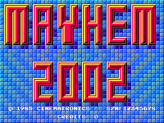 The title screen displays 'MAYHEM' in large red capital letters with blue outlines, centered in the upper half against a checkered blue background pattern. Below it, '2002' appears in matching red and blue styled text. At the bottom, small white text reads '© 1983 CINEMATRONICS' and 'CREDITS' with navigation indicators, indicating this is an arcade title screen with a classic 8-bit pixel art aesthetic using a limited color palette of red, blue, and white on a tiled background.
