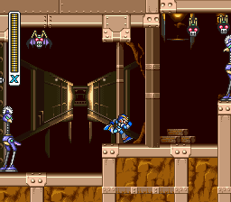 A split-screen view of Mega Man X navigating a vertical corridor. The left panel shows the blue-armored protagonist standing in a narrow shaft with brown walls and golden accents, with small enemy sprites visible above. The right panel displays a darker vertical chamber with similar architecture. A HUD panel at the bottom displays a tan-colored boss or stage icon. The sprite-based graphics use a 16-bit color palette with parallax-style depth layering typical of early 1990s side-scrolling action games.