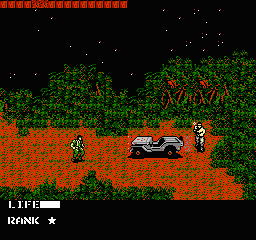 A soldier in white sneaking gear crouches in an outdoor area filled with dense green vegetation and orange-brown terrain. A military jeep with two occupants sits to the right. Red text reading "METAL" and other text appears in the upper right. The HUD shows "LIFE" and "RANK" bars at the bottom left. The scene uses low-resolution NES-style pixel sprites against a black sky backdrop with a red horizontal band at the top.