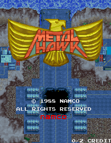 A large yellow eagle emblem with outstretched wings dominates the center of the screen, with red 'METAL HAWK' text overlaid across its body. Below the eagle are two gray stone pillar structures flanking the center. A blue textured background fills the upper portion. At the bottom, white text reads '© 1988 NAMCO ALL RIGHTS RESERVED' with 'NAMCO' and 'START' buttons visible on either side, and '© 2 CREDIT' text in the lower right corner. The overall composition uses a blue, yellow, and gray color palette typical of late-1980s arcade game design.