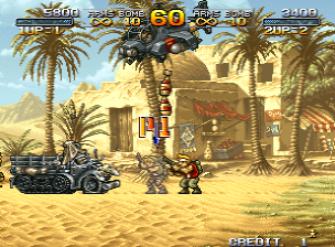 A large mechanical robot with red and yellow armor stands in a desert temple setting with palm trees and sandy terrain. Two small soldier sprites engage the robot from ground level. A vehicle sits stationary on the left side of the screen. The HUD displays a score counter, health/power meter at the top, and the word 'CREDIT' in the lower right. The art style uses hand-drawn pixel sprites with tan and blue color palette for the environment, set against a bright daylight sky with visible parallax scrolling layers.