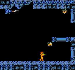Samus Aran stands on a blue-tiled floor in the center-left of the screen, rendered as a small orange and yellow sprite. The surrounding architecture features blue brick walls and platforms arranged vertically on the right side. A horizontal blue platform extends across the upper-right area with a yellow enemy or object above it. The top-left corner displays a health counter showing 30, while the top-right shows a yellow item or power-up icon. The background is entirely black, and the entire scene uses NES-era pixelated graphics with a limited color palette of blue, orange, yellow, and black.