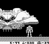 A monochrome Game Boy screenshot displays Samus Aran as a small sprite standing on rocky terrain in the lower half of the screen. Above her, a large alien creature with a bulbous head and extended appendages fills the upper portion. The sprite-based graphics use black-and-white pixel art typical of Game Boy hardware. Text at the bottom reads "E-39 A-D3D ❤ 39" indicating health, ammo, and missile count. The rocky environment features horizontal striations suggesting cave walls.