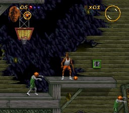 A top-down isometric view displays Michael Jordan in orange and black attire standing on a wooden platform in the center of the screen. A large dark creature or enemy looms in the upper left, while two smaller adversaries appear on the left side and lower right. The HUD shows Jordan's health indicator and score in the top corners. Green wooden structures and platforms compose the level geometry against a dark background. The sprite-based graphics use a limited SNES color palette with visible pixelation typical of early 1990s 16-bit games.