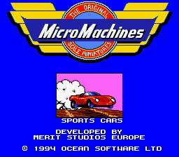 The Micro Machines title screen features a large yellow and red winged logo at the top against a bright blue background. Below sits a small red sports car illustrated on a pink rectangular banner labeled "SPORTS CARS" in white text. The screen displays developer credits reading "DEVELOPED BY MERIT STUDIOS EUROPE" and "PUBLISHED BY CODEMASTERS" in white font on the blue background. A copyright notice appears at the bottom in small text.
