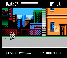 A side-scrolling beat-em-up level displays a small character sprite positioned in the lower-left area of a street scene. The background shows multi-story buildings in blue and orange with windows and doors, rendered in chunky pixel art. A green scrolling checkerboard pattern lines the left edge, while wooden fence sections divide the foreground. The HUD at the top shows "PLAYER ENERGY" with a health bar, "HP" counter, and "LEVEL" with score display "000/000" and experience meter "EXP 000/033" in the upper right. The palette uses primary colors typical of NES-era graphics with visible pixelation throughout.