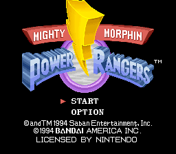 The title screen displays the Mighty Morphin Power Rangers logo centered on a black background, with the yellow Ranger emblem positioned above red banner ribbons containing white text. Below the logo sits a purple circular platform graphic. Menu options reading "START" and "OPTION" appear in white text with a right-pointing triangle indicator. Copyright information for Saban Entertainment, Bandai, and Nintendo licensing appears in small white text at the bottom of the screen.